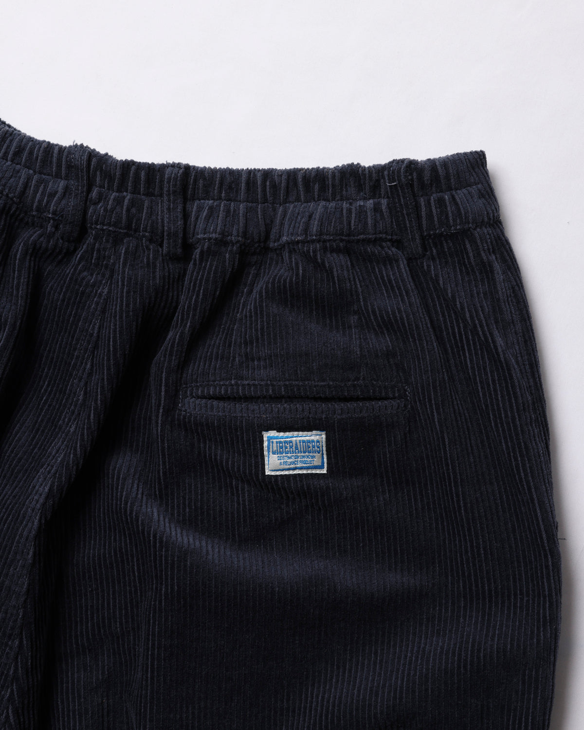 CORDUROY TAPERED SLACKS