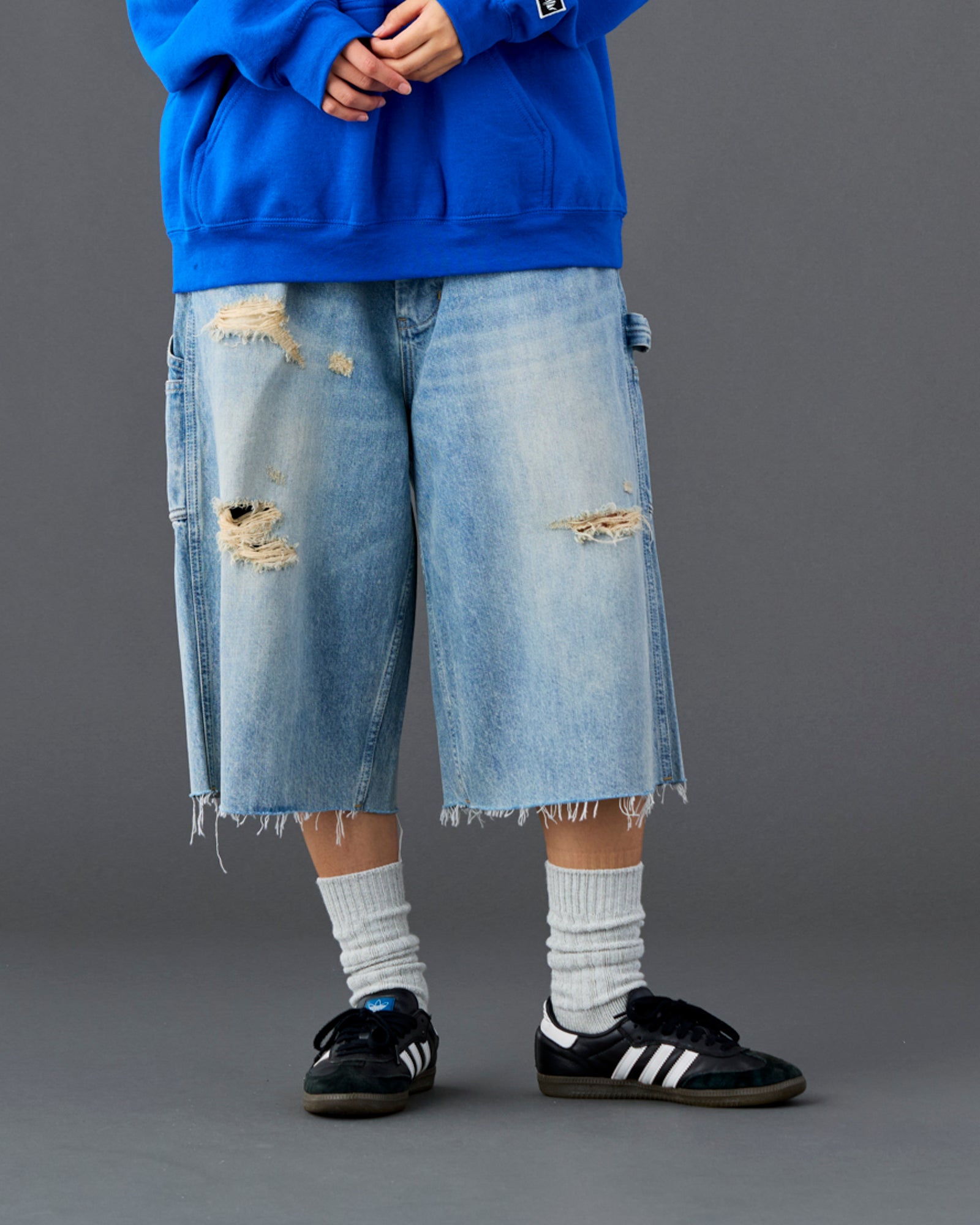 DAMAGED DENIM BUGGY SHORTS