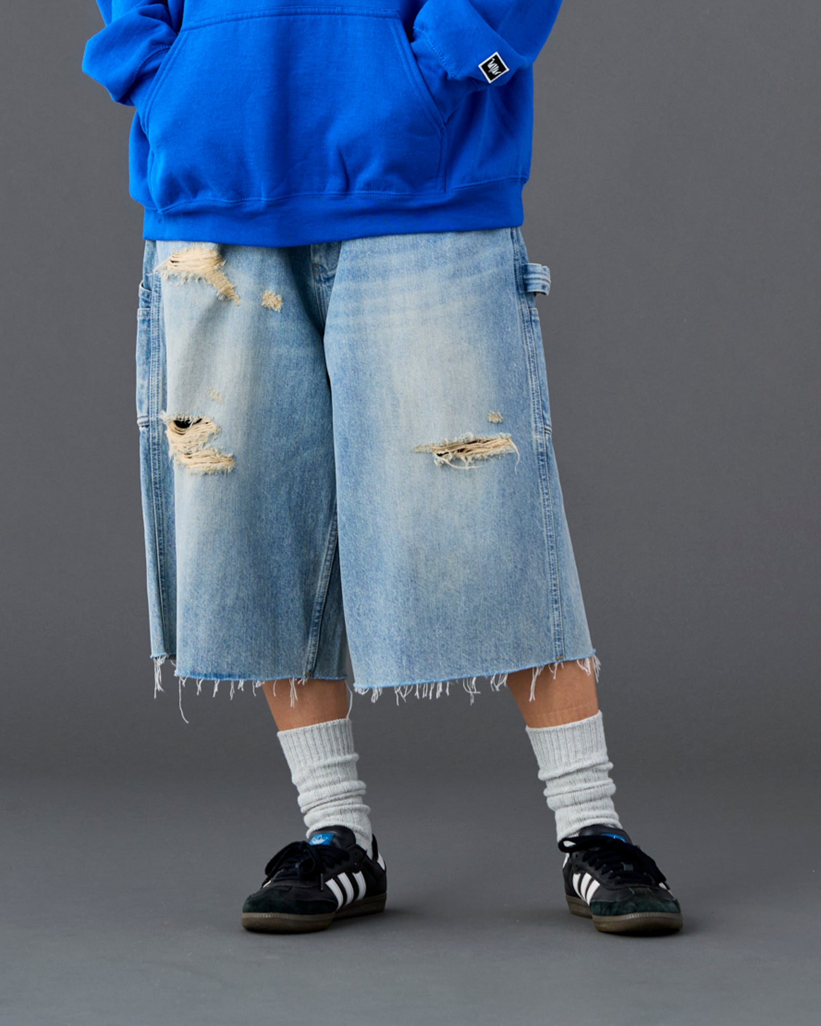 DAMAGED DENIM BUGGY SHORTS